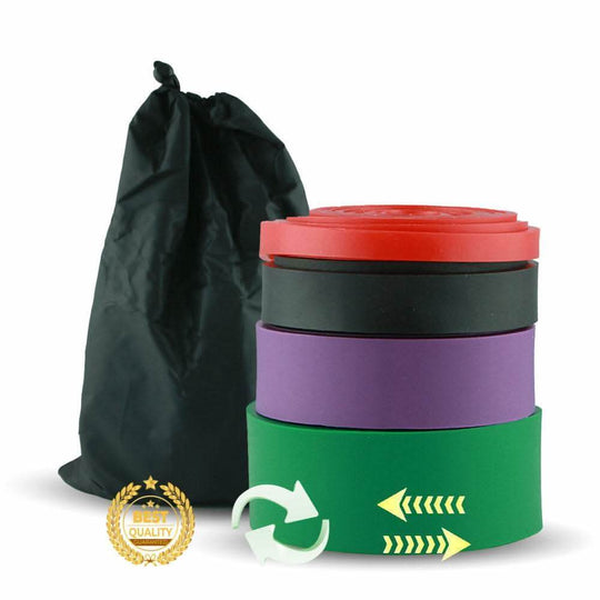 Vier farbige Widerstandsbänder gestapelt neben einem schwarzen Beutel.